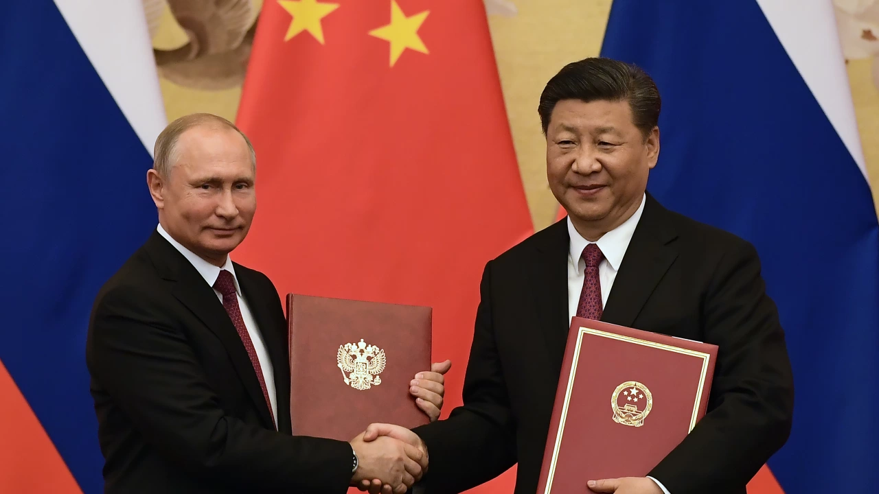 Китайският лидер Си Цзинпин и президентът на Русия Владимир Путин