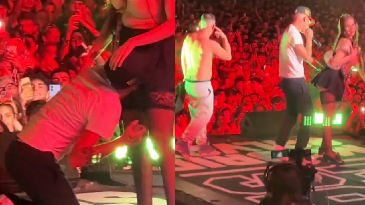 Рапър завря главата си между краката на една от танцьорките си по време на концерт